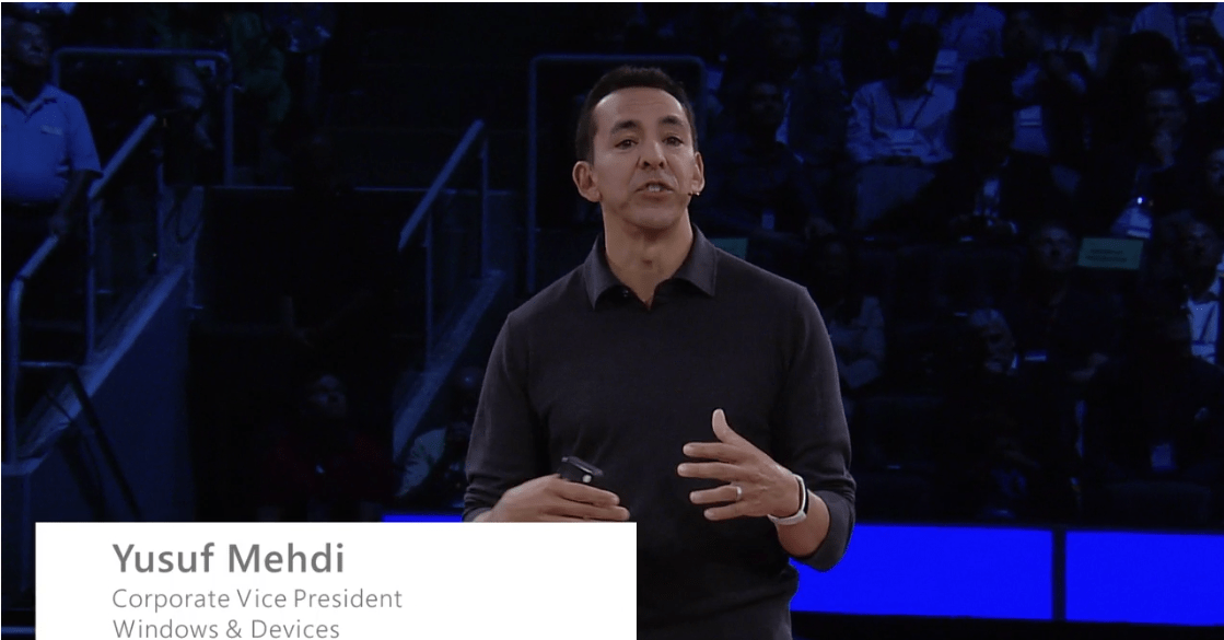 Yusuf Medhi wearing a white Microsoft Band at WPC 2016.