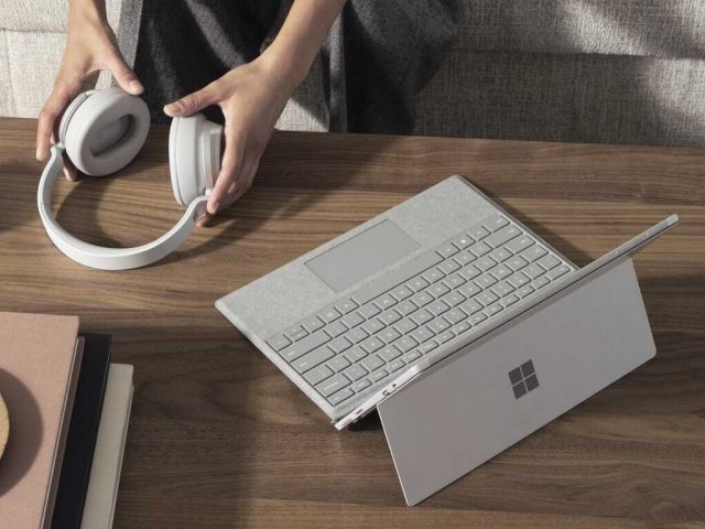 Bluetooth Surface Headphones Next To Windows 10 Surface Tablet