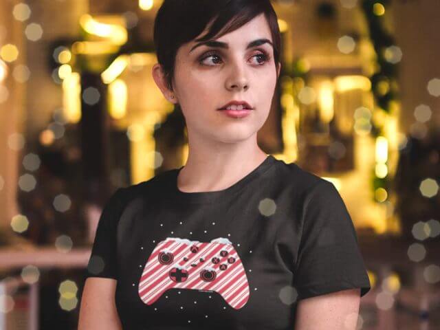 Woman wearing an Xbox Gear Shop Xbox controller Christmas T-shirt.