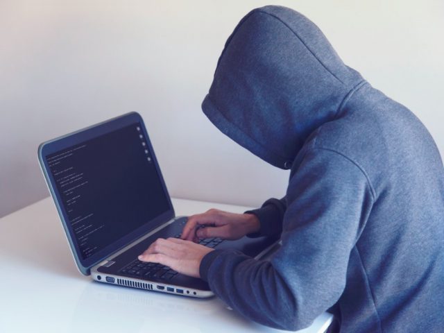 hacker in hoodie